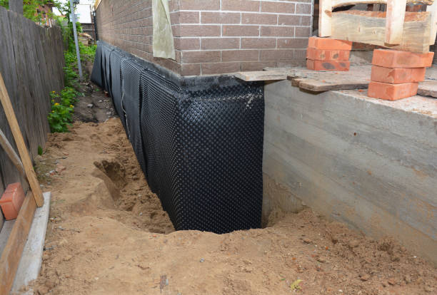 SJ Waterproofing Pros technician performing targeted Emergency Waterproofing assessment in Woodlawn, MD